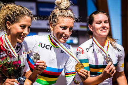Jolanda Neff, Pauline Ferrand Prévot and Rebecca McConnell celebrate on the podium at UCI MTB XCO Elite Women during the World Championships in Mont Saint Anne, Canada on August 31, 2019