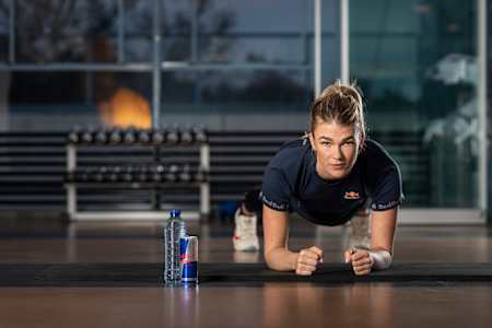 Athlete doing a plank during strength training.