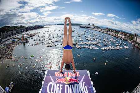 Constantin Popovici of Romania prepares to dive from the 27 metre platform at the Oslo Opera House during the Red Bull Cliff Diving Exhibition in Oslo, Norway on August 14, 2021.