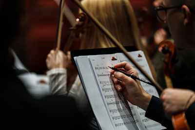 Musicians prepare for an electrifying performance with Baby Lasagna at Red Bull Symphonic rehearsals in Zagreb, Croatia on November 26, 2025, blending orchestral and modern energy