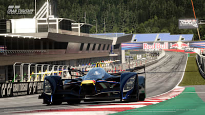 A Red Bull X2014 turning into the Red Bull Ring's first corner in the video game Gran Turismo 7.