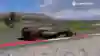 Zrzut ekranu z F1 24 pokazuje bolid Red Bulla Maxa Verstappena przed Iron Bullem na torze Red Bull Ring.