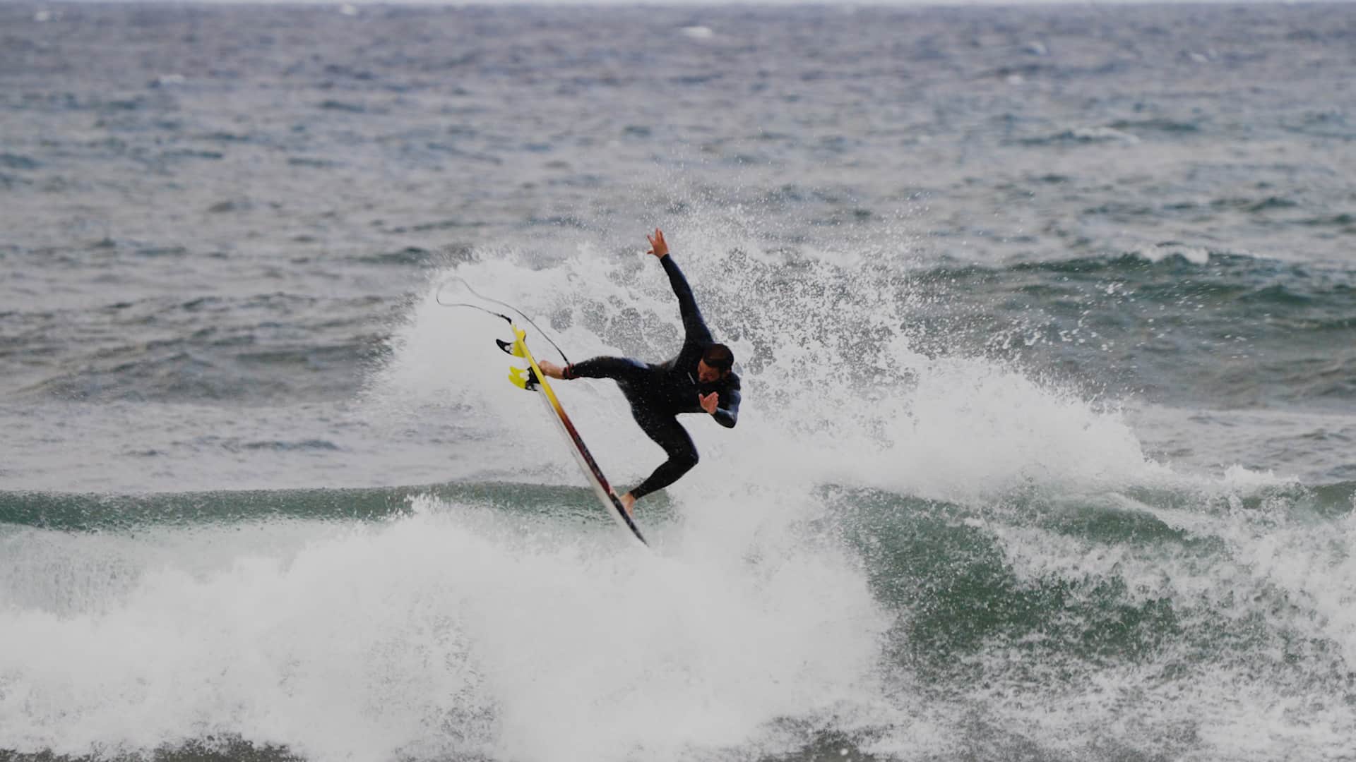 Roby D'Amico surfing at home in Italy.