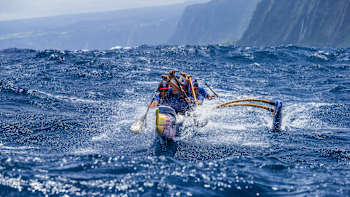The Red Bull Wa'a outrigger canoe paddling team in action in Hawaii.