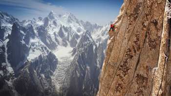 Jacopo Larcher climbs up a sheer rock face in a shot from Reel Rock S9 E3