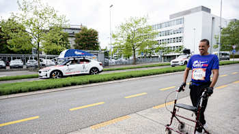 David Mzee of Switzerland gets caught by the catcher car during the Wings for Life World Run Flagship Run in Zug, Switzerland on May 8, 2022.