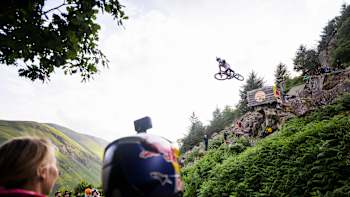 Bernard Kerr riding with Tahnee Seagrave and Jess Blewitt watching at Red Bull Hardline in the Dyfi Valley, Wales on July 12, 2023.