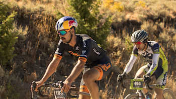 Payson McElveen and another rider cycle in the countryside for Just Ride, a podcast by Red Bull.