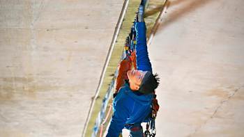 Climbers Tom Randall and Pete Whittaker scale a bridge on a motorway in the UK.