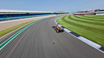 A shot of the Silverstone track from the drone as it keeps up with Max Verstappen