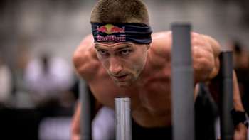 Jake Dearden captured in intense focus during the HYROX competition in Cape Town, South Africa, 2024, embodying the athletic energy and determination of Red Bull athletes