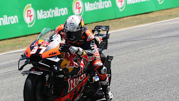 Pedro Acosta powers his Red Bull KTM race bike around Changwat Buriram circuit during Thailand MotoGP 2025, showcasing speed and skill in bold Red Bull livery