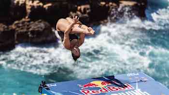 USA’s Meili Carpenter executes a dynamic dive from the 21-metre platform at the Red Bull Cliff Diving World Series 2025, Polignano a Mare, Italy, capturing the thrill of this iconic event