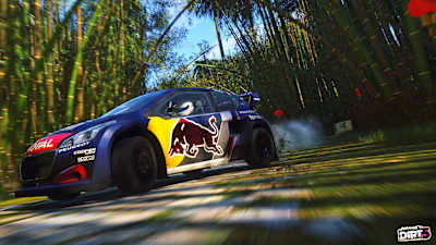 Screenshot of a Red Bull vehicle driving through palm trees in DIRT 5.