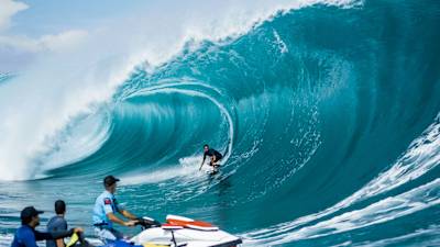 Kai Lenny rides the tube at Teahupo'o in Tahiti