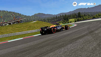 Screenshot from F1 24 shows the Red Bull RB 20 under the steel bull on the Red Bull Ring.