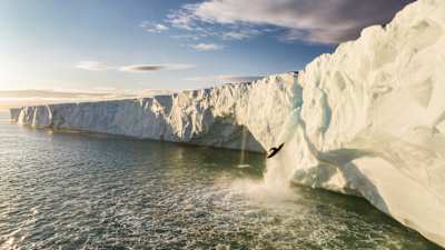 Aniol Serrasolses drops off the 20m-high ice waterfall on the Austfonna ice cap