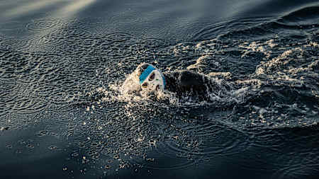 Ross Edgley swims a mask to protect himself from jellyfish during his Great British Swim attempt.