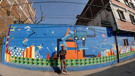 Abhedya Bhagawan with his graffiti artwork