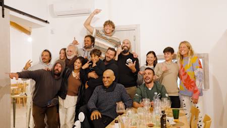 Leo Fioravanti and Stephanie Gilmore celebrate at the end of a No Contest shoot in Italy.