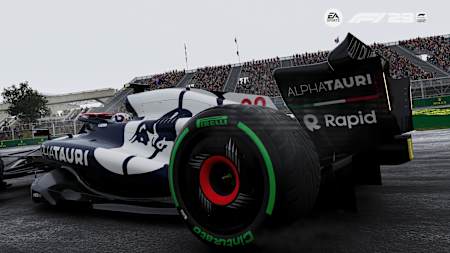 Screenshot aus F1 23 zeigt den AlphaTauri von Yuki Tsunoda in Kanada bei Regen.