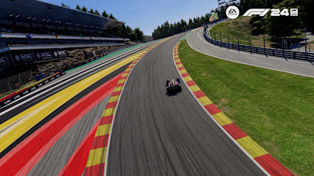 Screenshot from F1 24 shows Max Verstappen driving through the Eau Rouge corner at Spa-Francorchamps, Belgium.