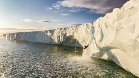 Aniol Serrasolses drops off the 20m-high ice waterfall on the Austfonna ice cap