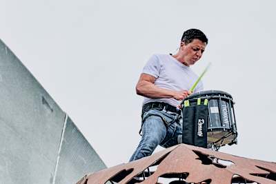 Martin Grubinger plays a drum on top of the bull sculpture at the Red Bull Ring in Spielberg, Austria on June 22, 2020.