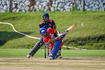 Dynamic play during the 2023 Red Bull Campus Cricket League Match at Abhimanyu Cricket Academy Stadium in Dehradun, India, capturing the spirit and energy of Red Bull's global cricket showcase