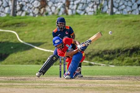 Dynamic play during the 2023 Red Bull Campus Cricket League Match at Abhimanyu Cricket Academy Stadium in Dehradun, India, capturing the spirit and energy of Red Bull's global cricket showcase