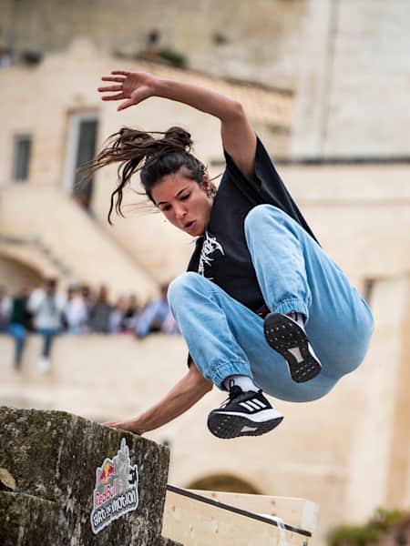 Hazal Nehir of Turkey performs during the finals at the "Red Bull Art of Motion" freerunning competition in Matera, Italy on October 5, 2019.