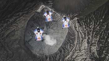 The team above a smoking volcano 