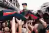 A photo of Sebastian Vettel being thrown into the air by his Toro Rosso team-mates in the paddock after winning the 2008 Italian Formula One Grand Prix.