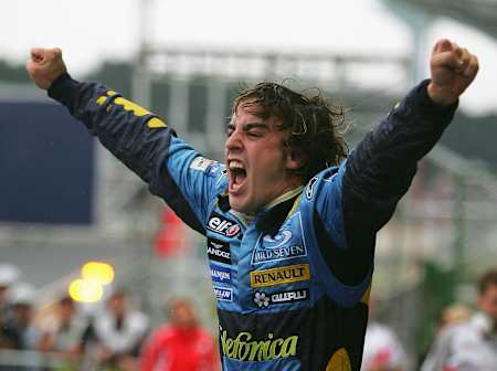 Fernando Alonso celebrates winning his first of two Formula One world tiles in Brazil in 2005.