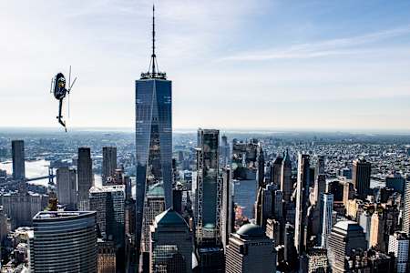 Red Bull Aerobatic Helicopter Pilot, Aaron Fitzgerald, performs flips, barrel rolls and nose dives over the New York City skyline during the morning hours on May 18th 2019. 