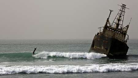 Land mines on shore and shipwrecks in the water