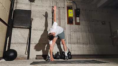 You get a big rotation through the torso and a big stretch on your outside hip when performing a windmill stretch.