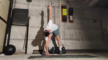 You get a big rotation through the torso and a big stretch on your outside hip when performing a windmill stretch.