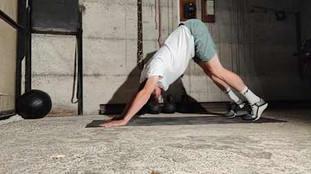 The downward dog is a total body posterior stretch – you should feel a big stretch across the hamstrings, calf muscles, upper back and the outside of the shoulders