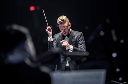 An image of composer Brian Tyler in action.