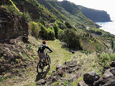 A mountain biker rides on the Praia trail on Sao Miguel island in the Azores.