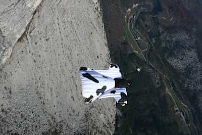 Domenico Berti flies a custom-made wingsuit resembling a cow.