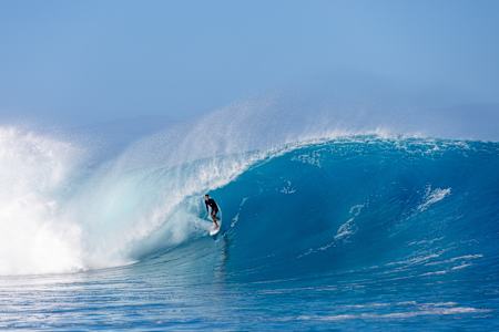 Jack Robinson rides the tube while surfing at Cloudbreak in Fiji.