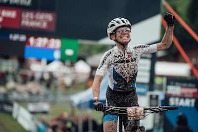 Lecomte celebrates her win after the UCI MTB Cross-Country World Cup at Les Gets, France, on July 4, 2021.