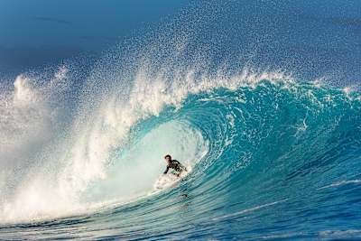 João Chianca rides the tube at Cloudbreak in Fiji