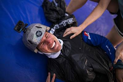 Lars Meerstetter (SUI4) beams with triumph at the Red Bull X-Alps 2025 in Zell am See, Austria.