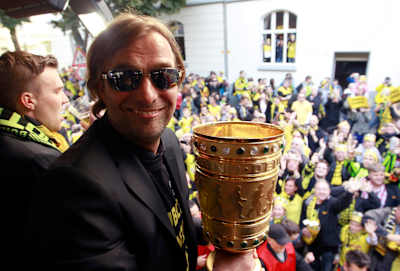 Jürgen Klopp celebrates with the DFB-Pokal in Dortmund.