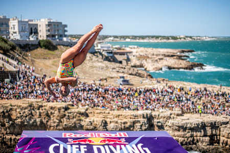 Iris Schmidbauer of Germany dives during the final competition day of the seventh stop of the Red Bull Cliff Diving World Series at Polignano a Mare, Italy on September 18, 2022.