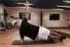 Red Bull athlete doing core exercises.