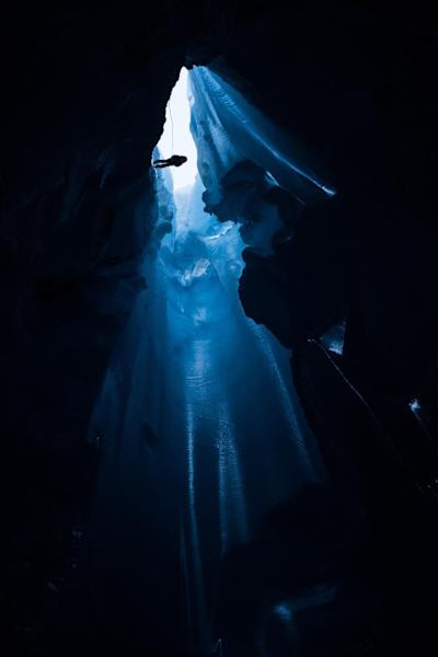 Will Gadd climbs into a moulin during his trip to climb the Greenland ice cap in August 2018.